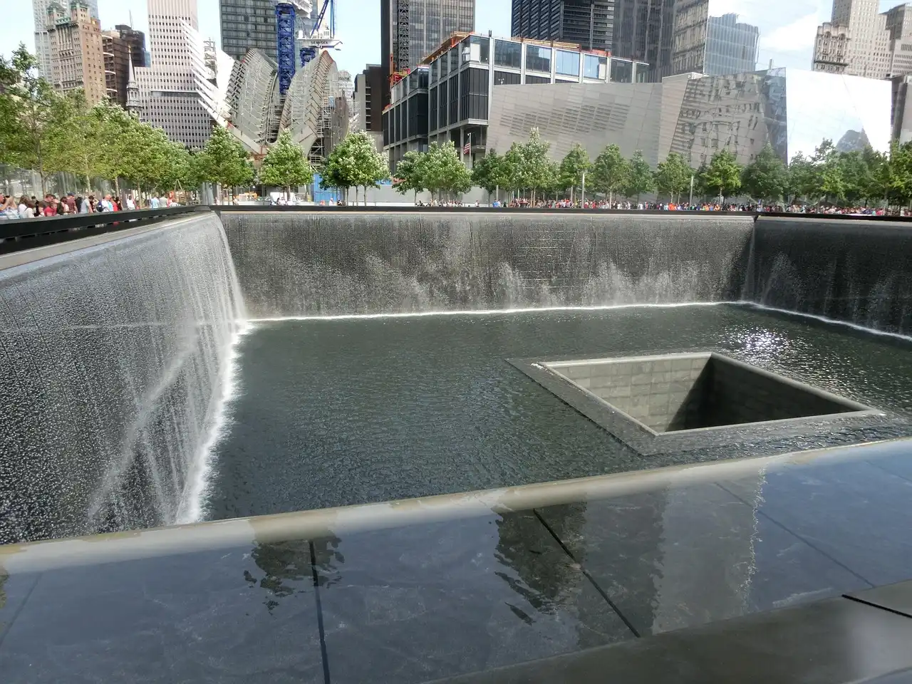 The 9/11 Memorial pool with water falling into the centre