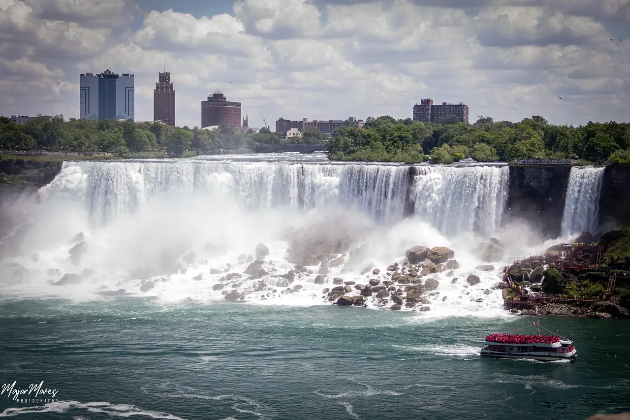 The American Falls at Niagara with a tour boat below