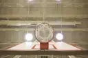 A basketball hoop under bright lights