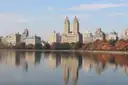Autumn trees and the twin towers of the San Remo reflected in Central Park's reservoir