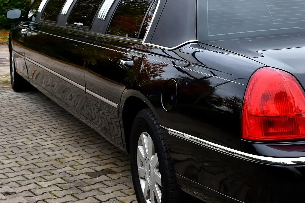 The side of a black stretch limousine