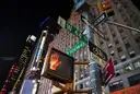 Broadway and West 44th Street signs at night
