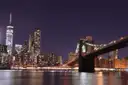 Lower Manhattan and the Brooklyn Bridge at night from the water