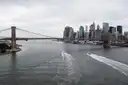 Boats on the East River below the Brooklyn Bridge and the Lower Manhattan skyline