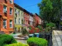 Colourful row houses with flower gardens on a Brooklyn street