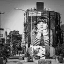 A graffiti-covered Brooklyn facade, in black and white
