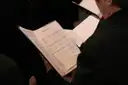 Choir singers holding sheet music