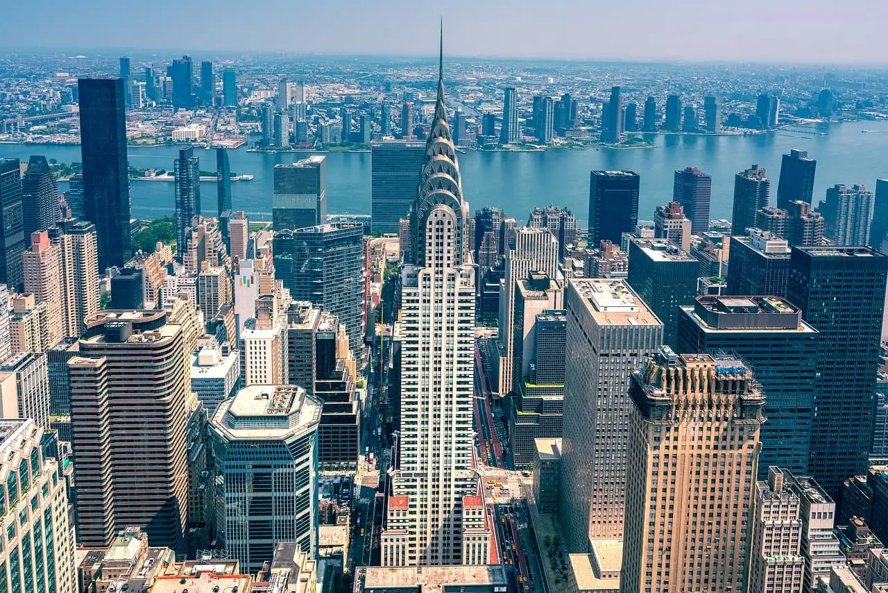 The Chrysler Building and Midtown East seen from high above, with the East River behind