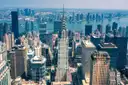 The Chrysler Building and Midtown East seen from high above, with the East River behind
