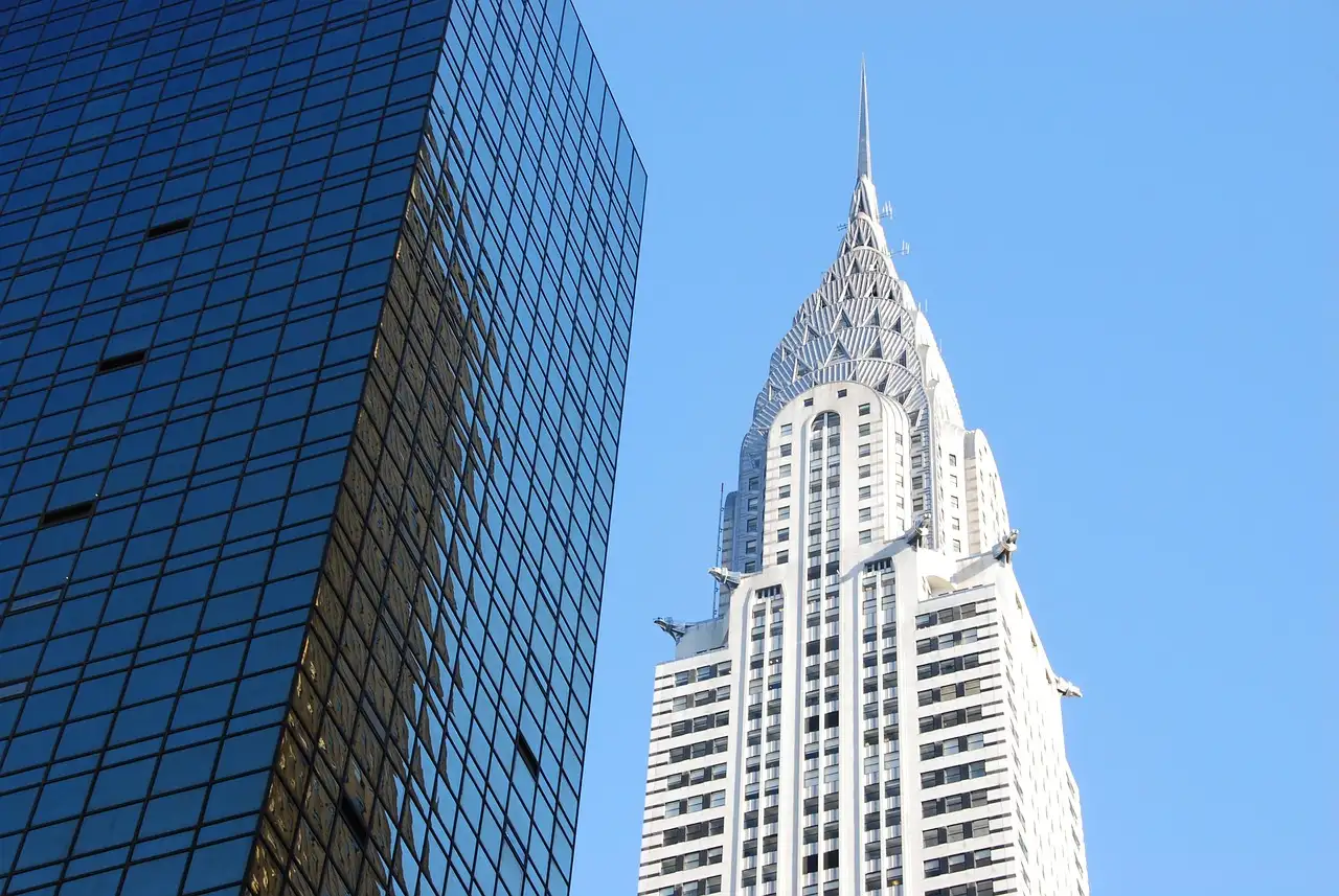 The Chrysler Building's spire against blue sky