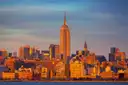 The Empire State Building glowing in golden evening light