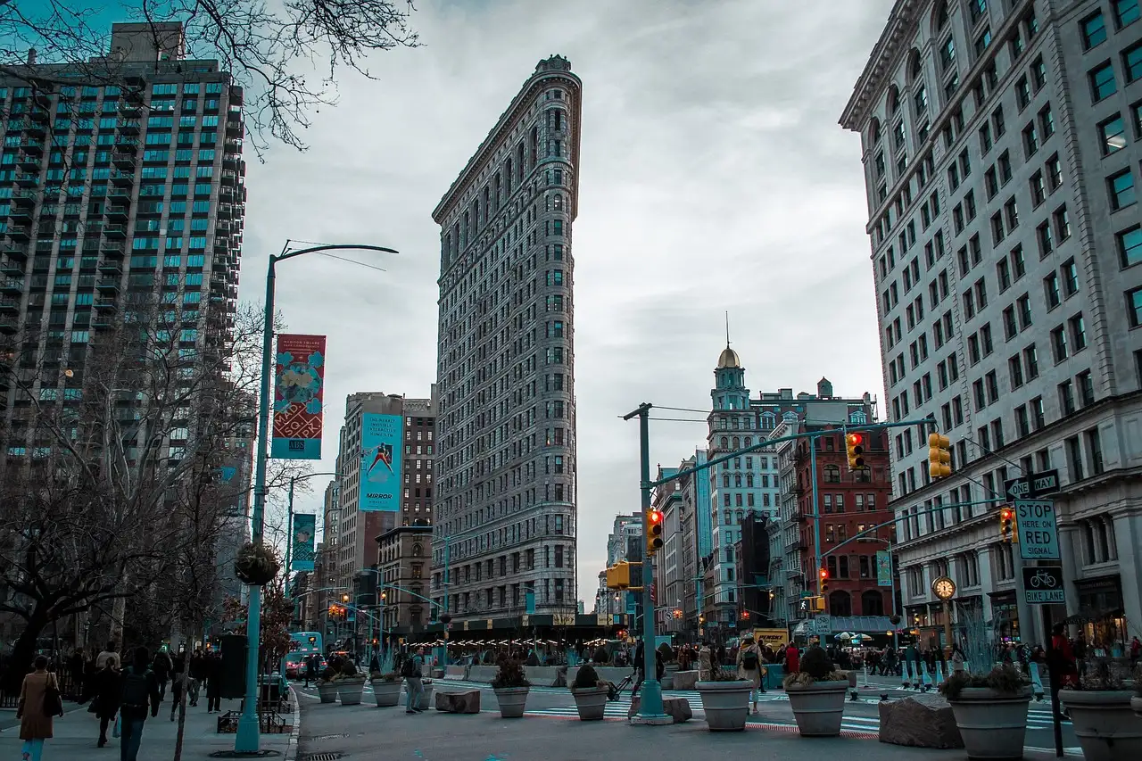 The Flatiron Building at the end of a Manhattan street