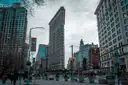 The Flatiron Building at the end of a Manhattan street