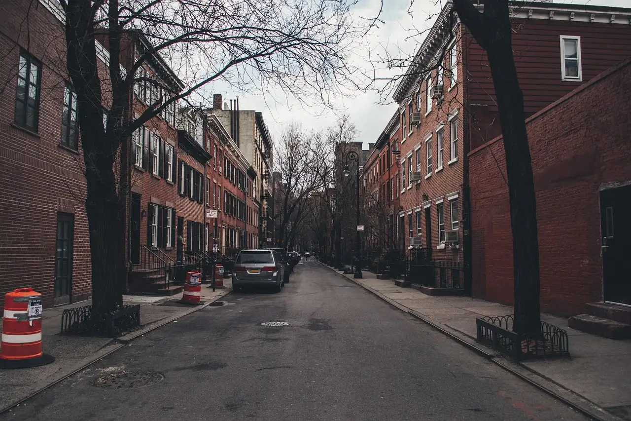 A tree-lined brick street in the Village