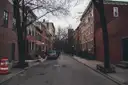 A tree-lined brick street in the Village