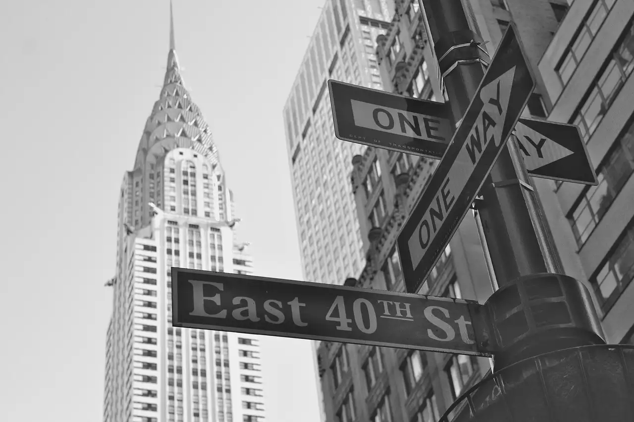 The Chrysler Building behind an East 40th Street sign and a one-way sign in Midtown