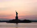 The Statue of Liberty at pink dusk
