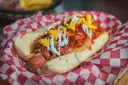 A hot dog loaded with toppings