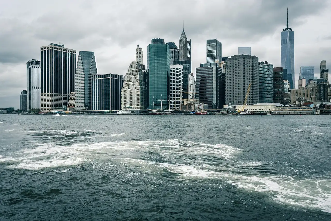 Lower Manhattan seen from a boat on choppy water