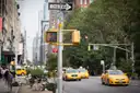 Yellow cabs on a Manhattan avenue