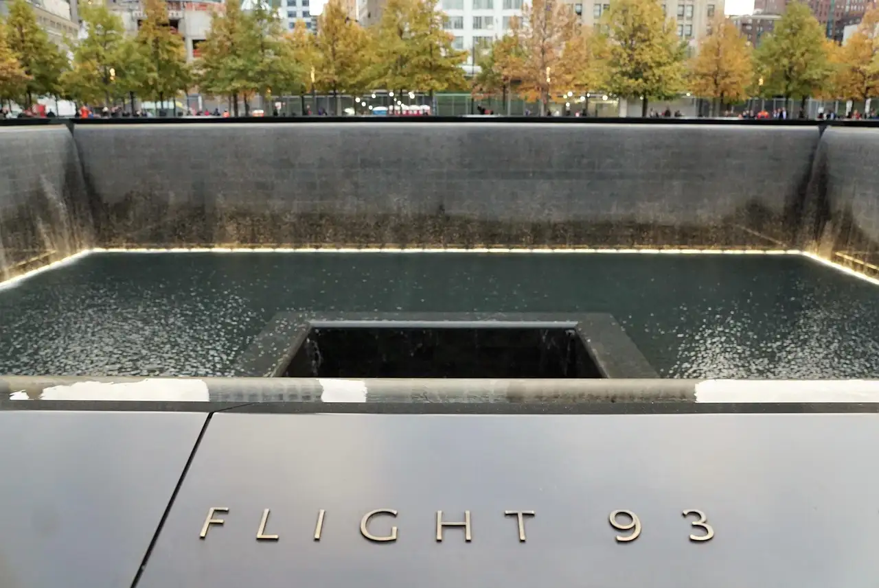 The memorial pool edge with the Flight 93 panel
