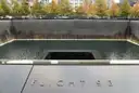 The memorial pool edge with the Flight 93 panel