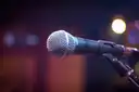A microphone on a stand in blue light
