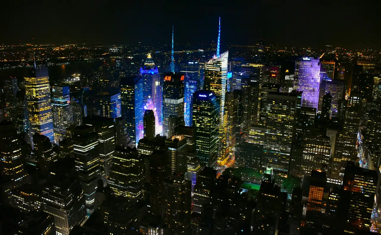Midtown Manhattan at night with the Empire State Building lit