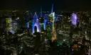 Midtown Manhattan at night with the Empire State Building lit