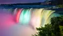 Niagara Falls lit in colours at night