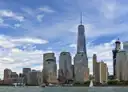 One World Trade Center above the Financial District, seen from the water