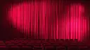 A red velvet curtain closed across a stage