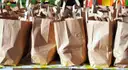 A row of paper shopping bags