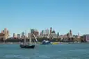 A schooner sailing past Manhattan