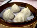 Soup dumplings in a bamboo steamer