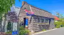 An old shingled shop on a street in Southampton