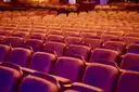 Rows of red theatre seats