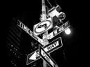 A Times Square street sign, in black and white