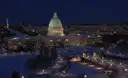 The US Capitol at night in snow