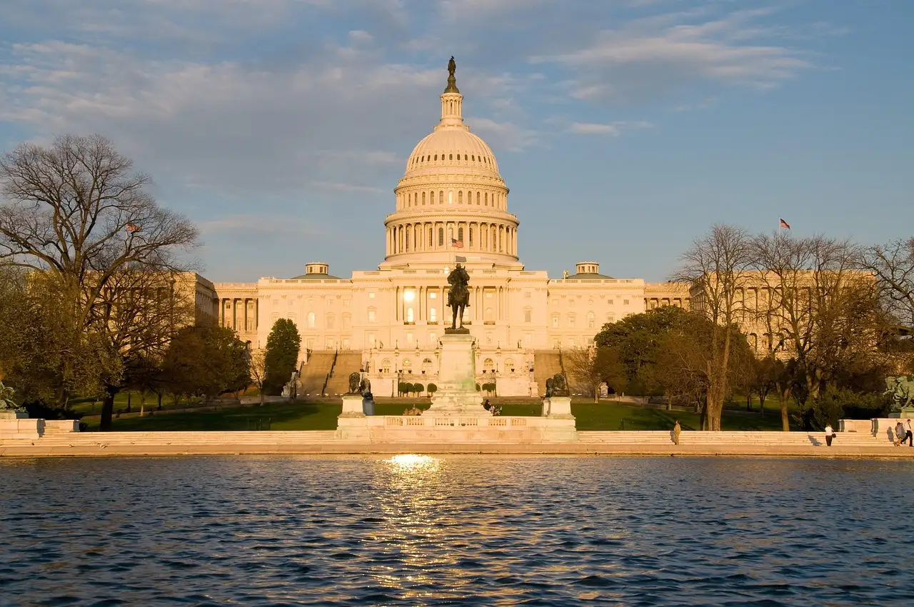 The US Capitol reflected in the pool at sunset