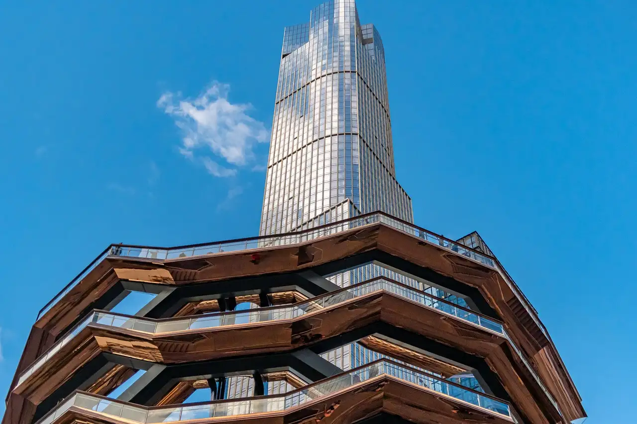 The Vessel with a tall Hudson Yards tower behind