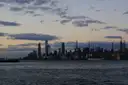 The Midtown Manhattan skyline, with the Hudson Yards towers and the Empire State Building, across the Hudson River at dusk