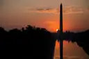 The Washington Monument reflected in the pool at sunrise