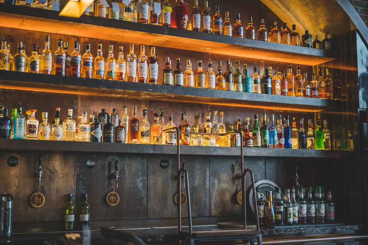 Bottles on an old wooden back bar