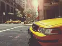 A yellow taxi on a New York street