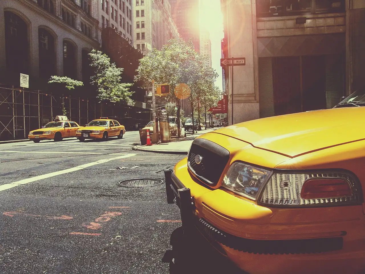 A yellow taxi on a New York street